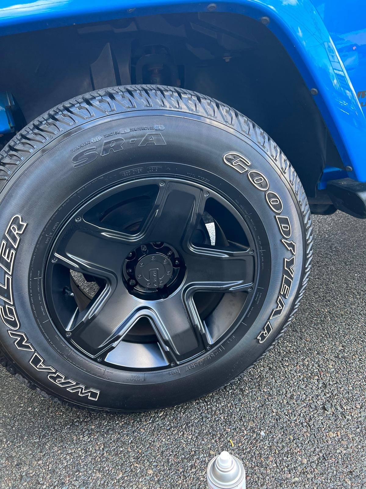 Custom black wheel installation on Jeep Wrangler at Stop Car